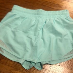 Mint green shorts with flower print at bottom